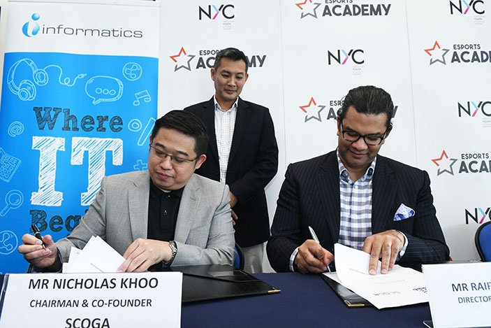 Nicholas Khoo, Chairman, SCOGA signing a partnership for the launch of The Esports Academy with Raiford Cockfield III, Director of APAC Partnerships, Twitch.